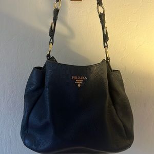Soft leather black Prada purse looks  new w/thick adjustable shoulder strap